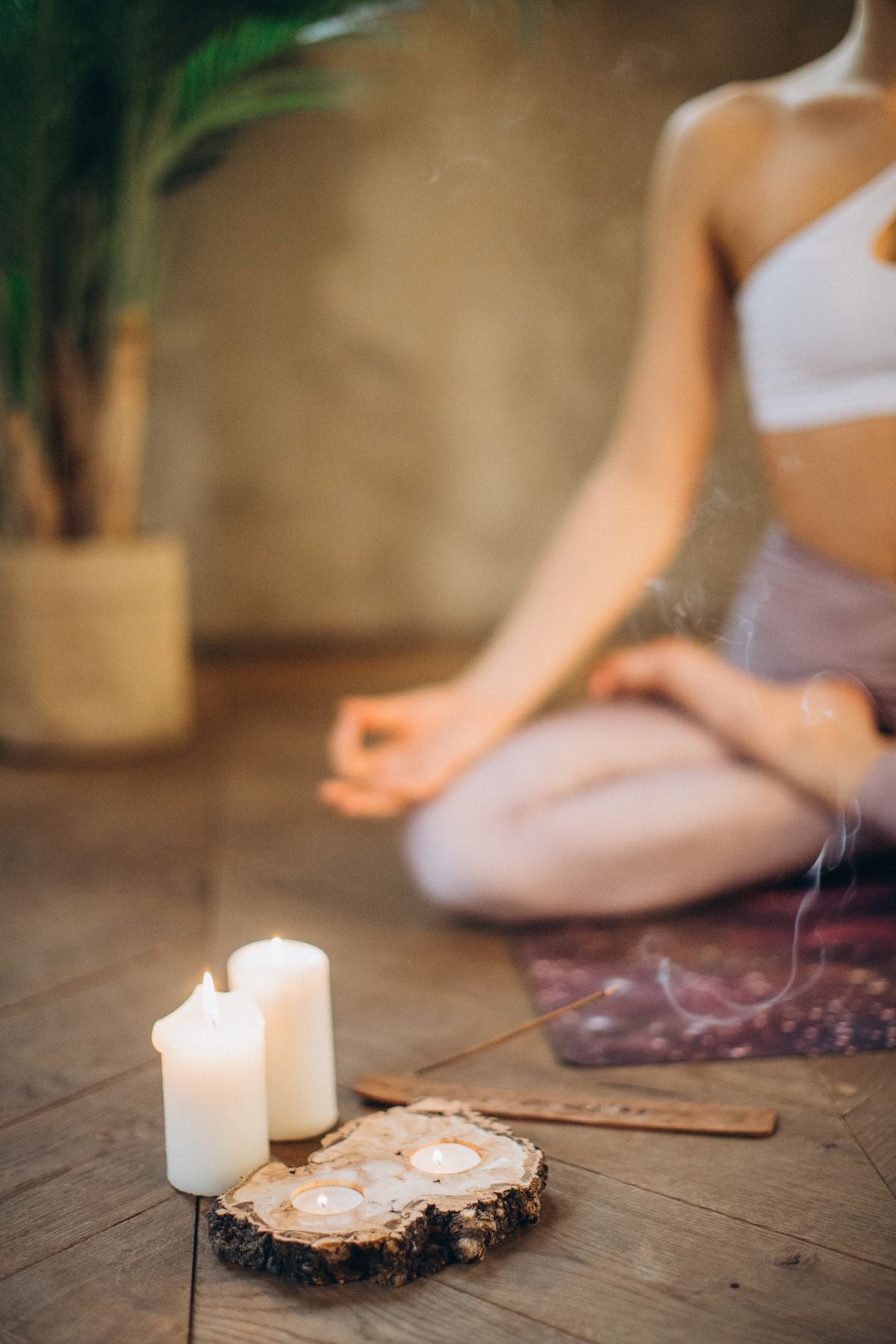 Candles and incense set up for a meditation session